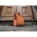 stylish purse in orange colour with long adjustable shoulder strap in brown colour