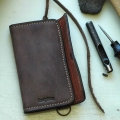 leather wallet closed with a strap with original orange zipper made by ladybuq