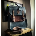 roomy backpack with shoulder and handbag function made out of genuine leather in plum and ginger color