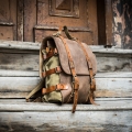 Original oldschool leather backpack in Brown color with comortable pocket on the back and long strap