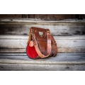 handmade purse out of high quality leather in ginger and red colors