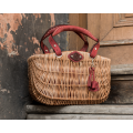 Unique wicker basket with additional red leather items by Ladybuq Art