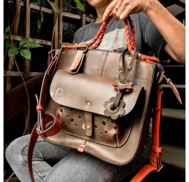 Original leather handbag in brown and red color 