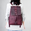 Handcrafted leather purple color backpack